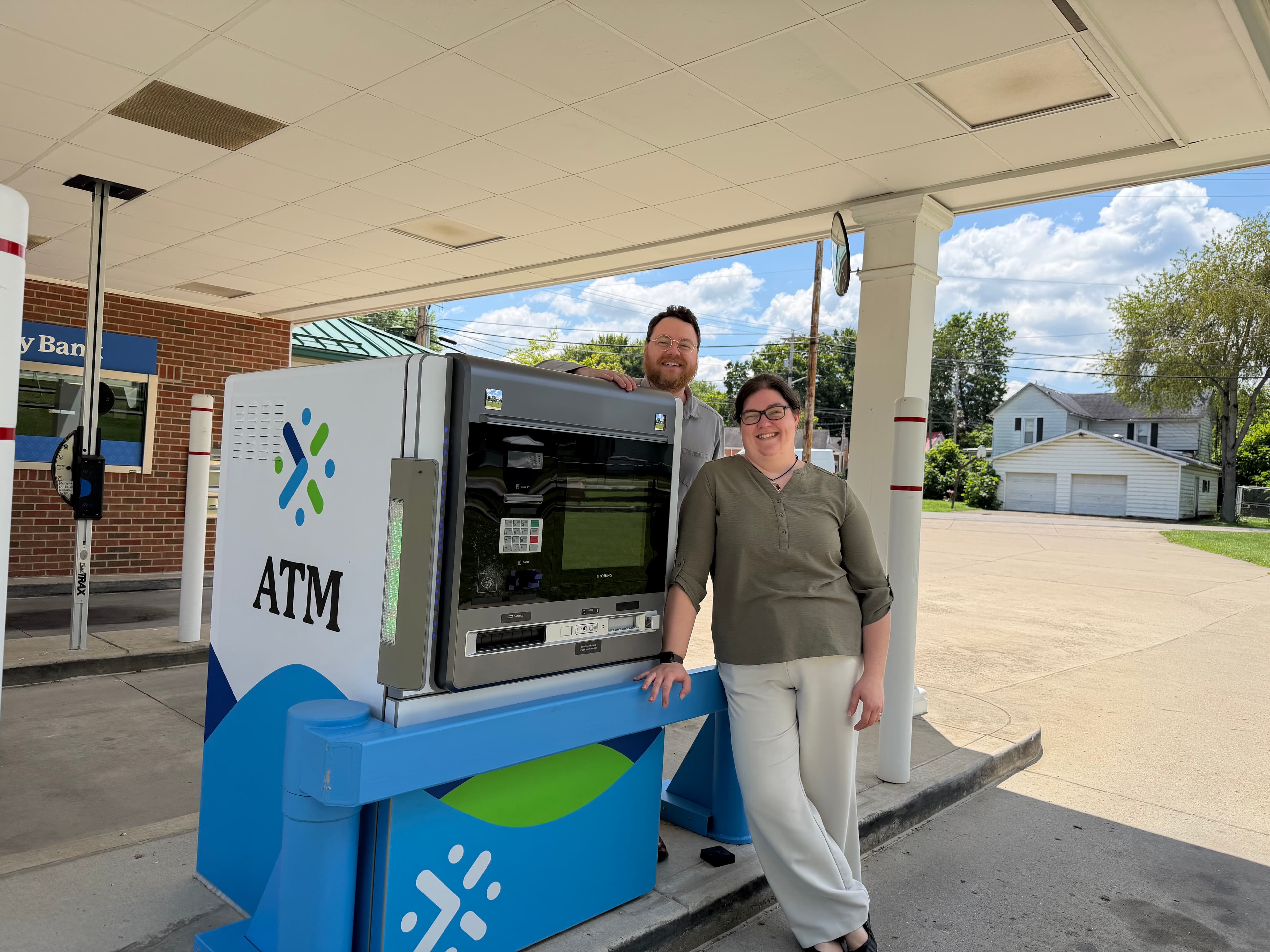 A CBC technician servicing a Hyosung ATM